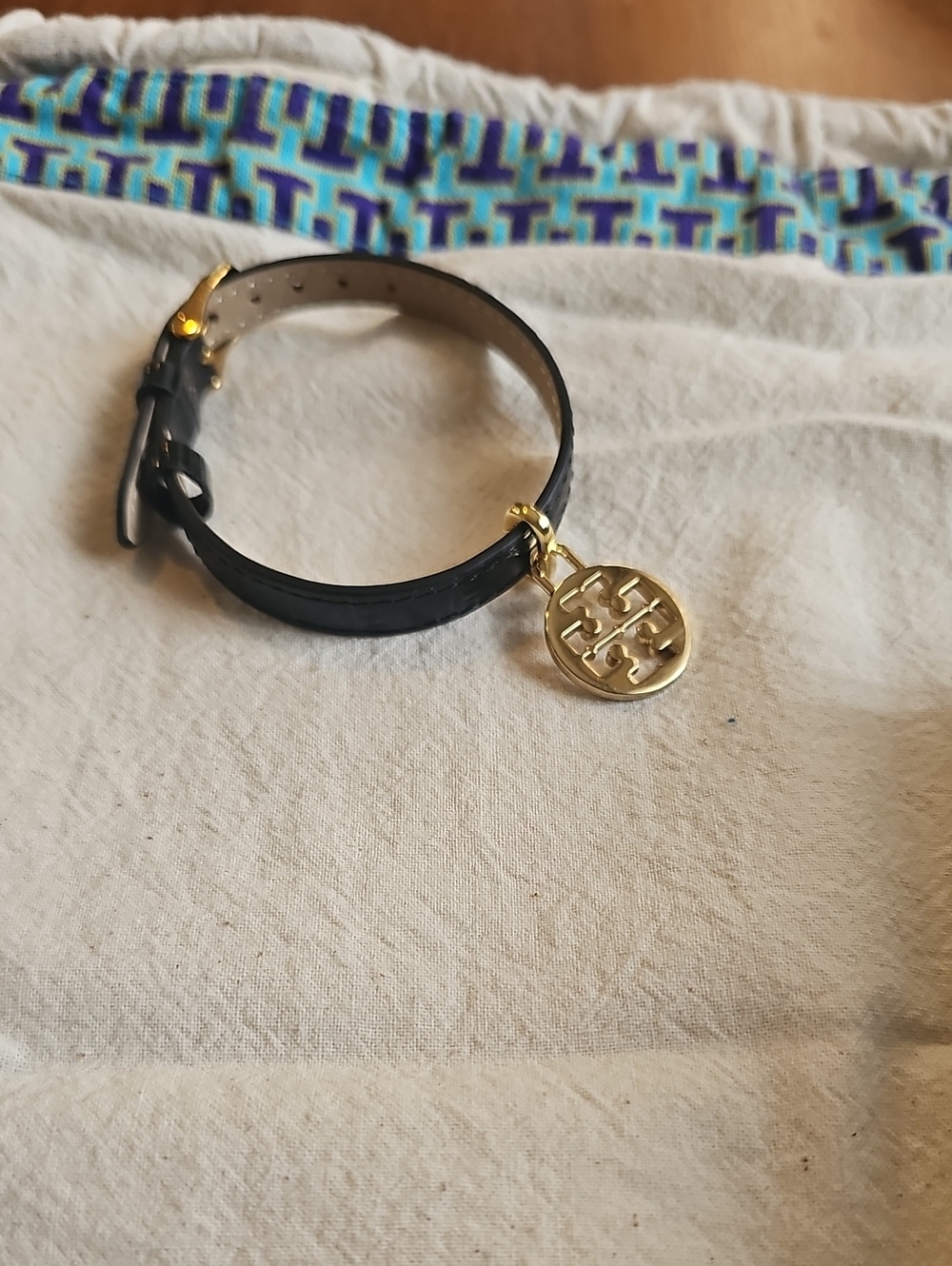 Tory Burch Dust Bag With Black Leather Bracelet with Gold Logo Charm